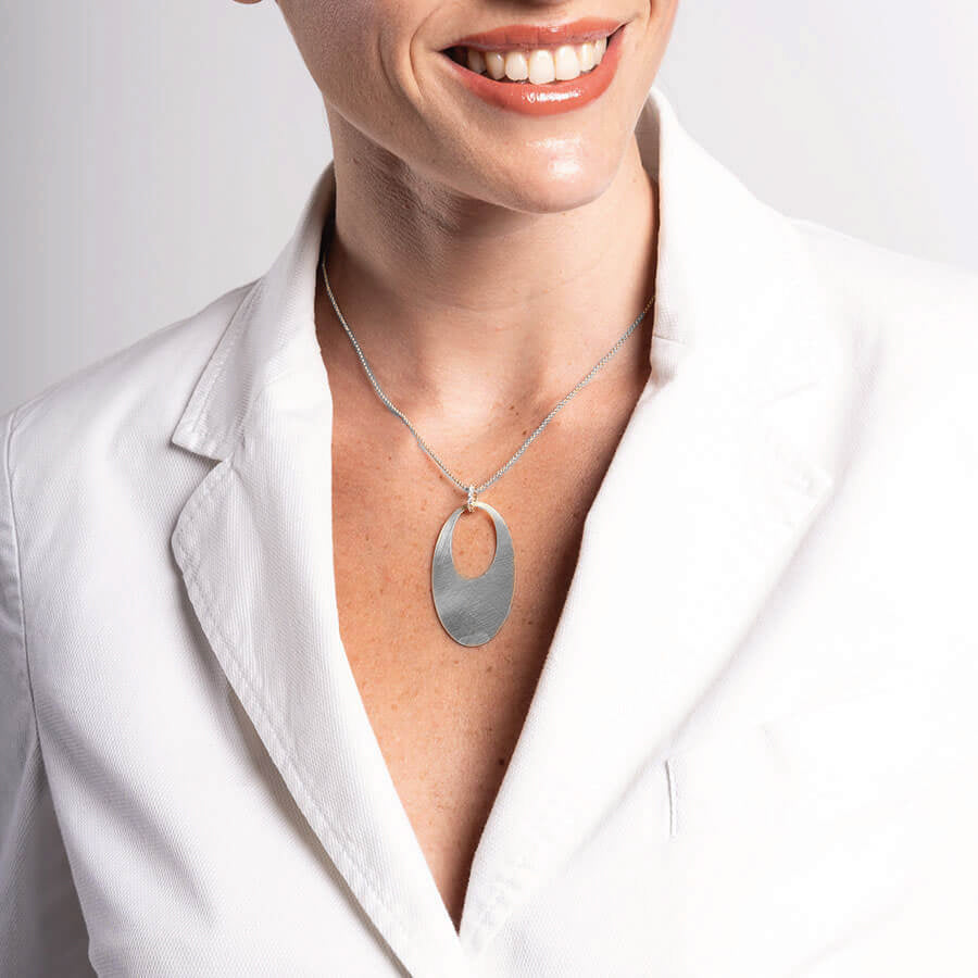 Retro necklace with hand-brushed oval pendant